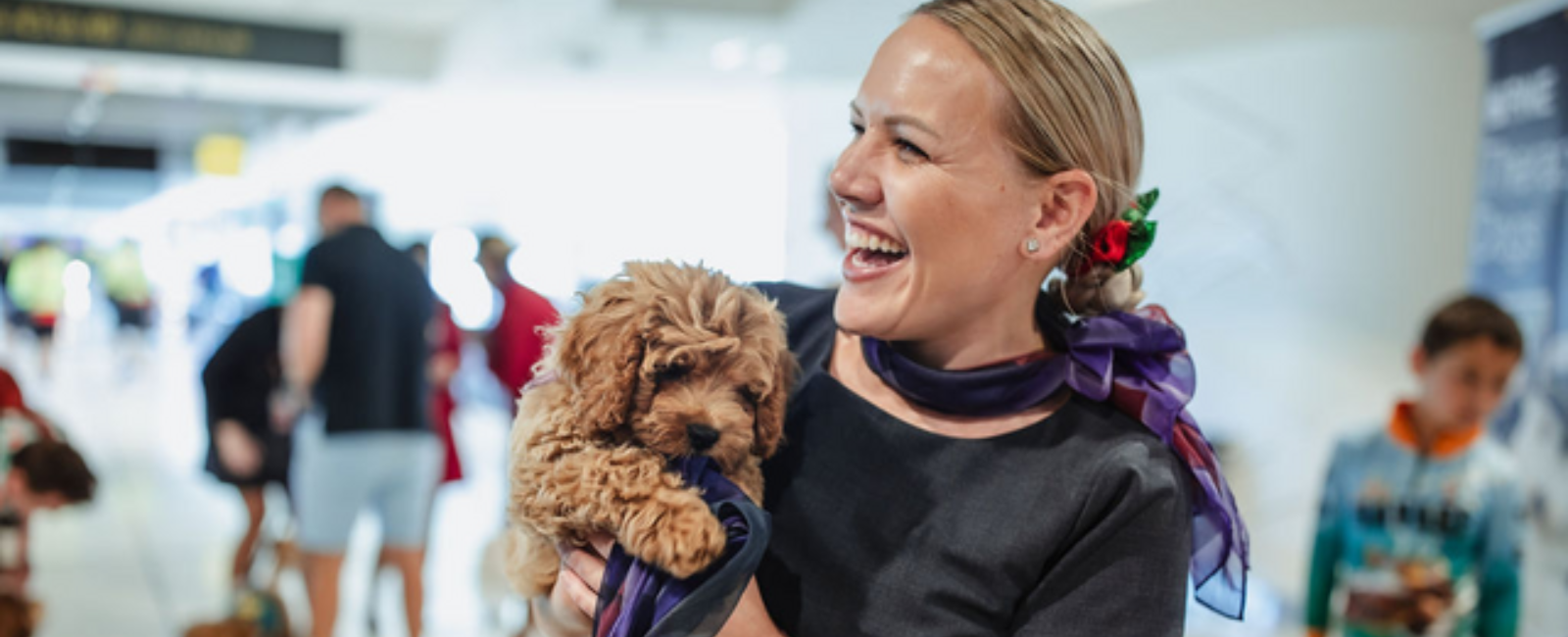 Therapy dog with Brisbane Airport staff